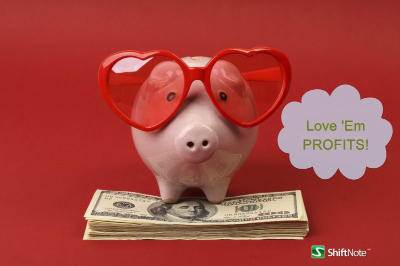 Piggy-bank-with-heart-sunglasses-standing-on-stack-of-money.jpg